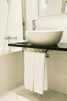 Elegance white washstand and faucet with towels