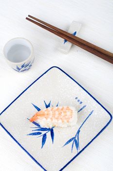 sushi with chopstick and plate