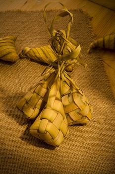 Ketupat: South East Asian rice cakes bundle, often prepared for festivities and celebratory occasions.
