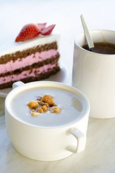 creamy mushroom soup with cake and coffee