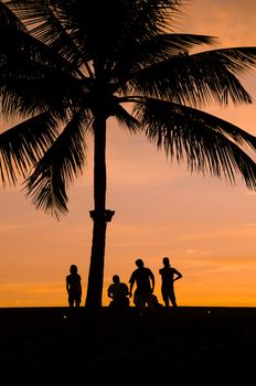 silhouette of people and tourist during a beautiful sunset
