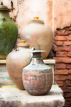 Collection of vintage urns and pots in a courtyard