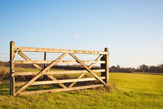 An open gate on farmland in England