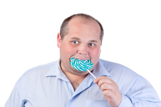 Fat Man in a Blue Shirt, Eating a Lollipop, isolated