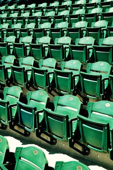 Several rows of green folding seats in a Major League baseball stadium