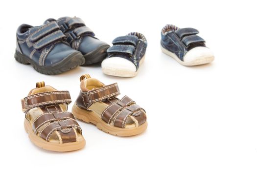 Selection of children's shoes on a white background