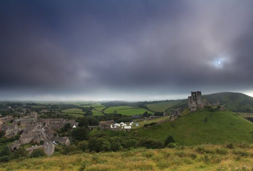 Norman dark ages castle ruin in dorset england in thick sea mist