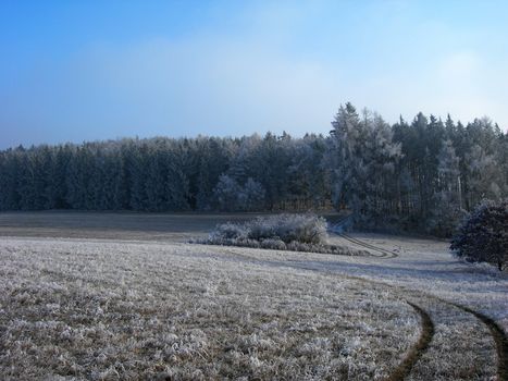      Lonely road in the winter country with a snow and ice      