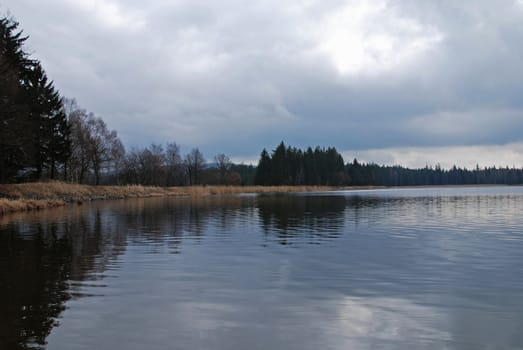 Lake in the early spring with a dramatic sky
