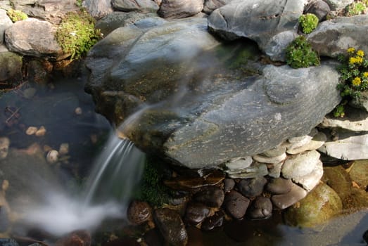 Beautiful brook falling down from the stones