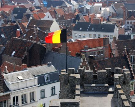 Beautiful gabled houses with a national flag. Gent, Belgium. 