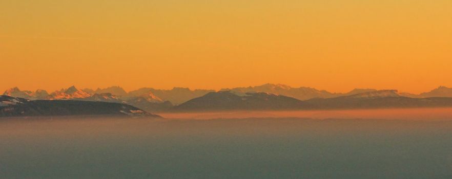 Alps and snow and sky orange