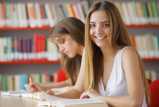 Female College Students in a Library