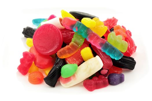 assorted selection of gummy candy or jelly in a variety of colors shapes and flavors isolated