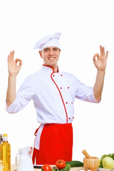 Young cook preparing food wearing a red apron