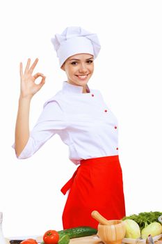 Young cook preparing food wearing a red apron