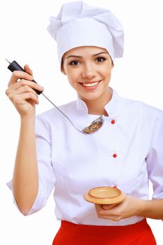 Young cook preparing food wearing a red apron