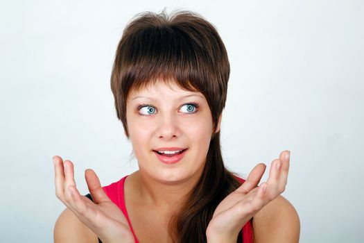 admiration for the young attractive girl teenager. Portrait on a light background