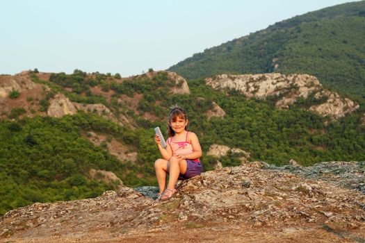 little girl holding tablet pc