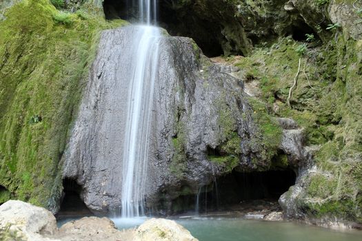 waterfall and cave nature scene