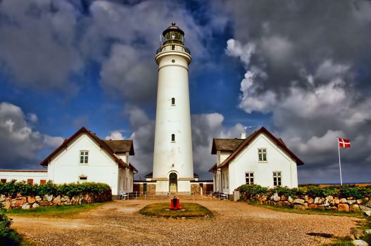Hirtshals lighthouse in Denmark including a dansih flag