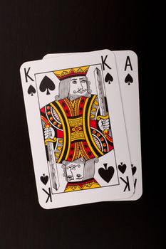 Playing cards on a black table