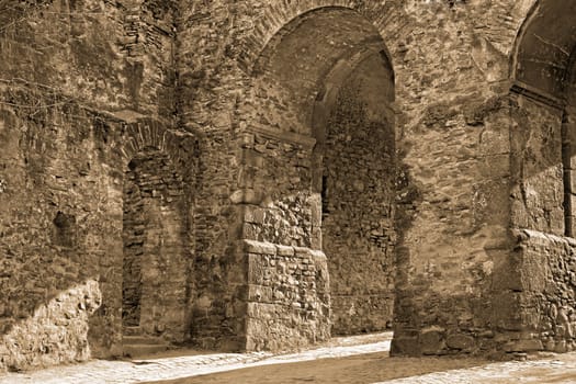 Sepia tones detail of the main entrance in the Sighisoara fortress from Transylvania,Romania.Sighisoara is a beautiful and well preserved inhabited citadel in Europe,with an authentic medieval architecture.