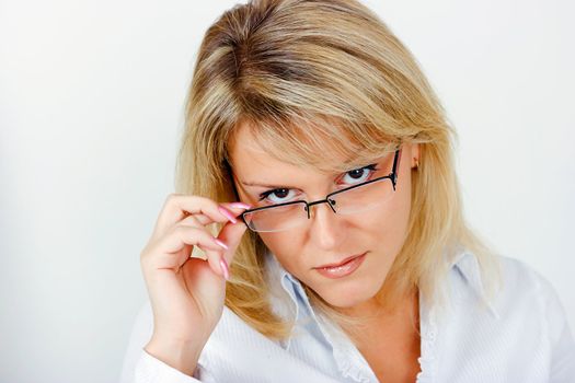 portrait of a smiling young business woman in glasses