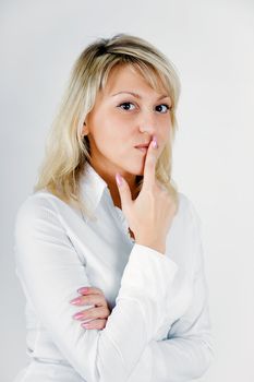 Young attractive business woman on a light background