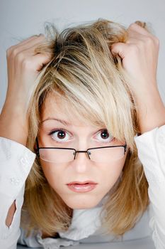 tired young businesswoman wearing glasses