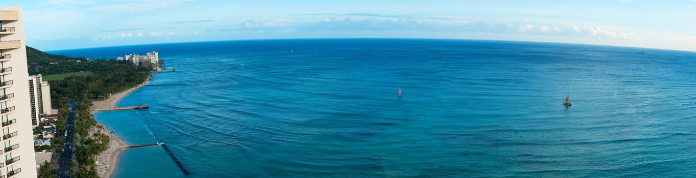 A panoramic shot of the ocean off the coast of Oahu at Waikiki from the 38th floor