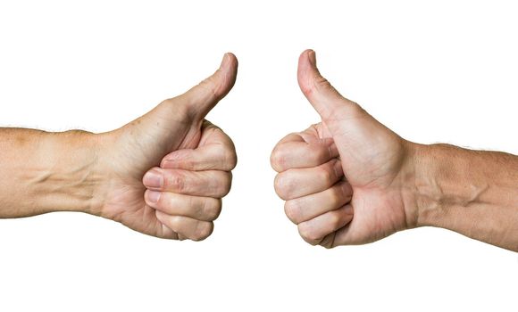 Pair of caucasian hands in thumbs up gesture of senior middle aged male isolated against white