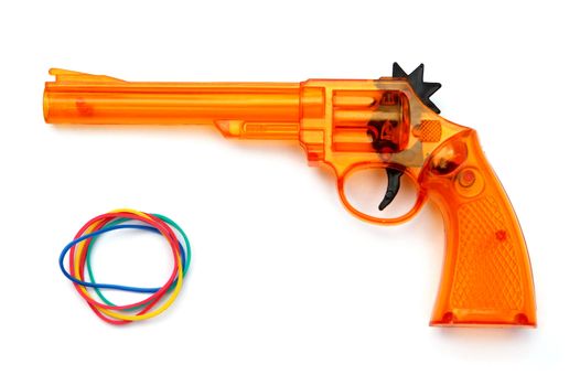 Toy plastic gun and elastic band for child , on a white background 