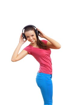 Happy smiling girl dancing and listening to music