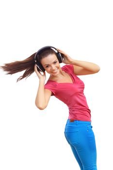 Happy smiling girl dancing and listening to music