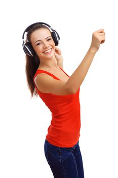 Happy smiling girl dancing and listening to music