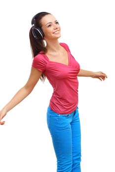 Happy smiling girl dancing and listening to music