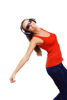 Happy smiling girl dancing and listening to music