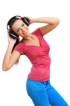 Happy smiling girl dancing and listening to music