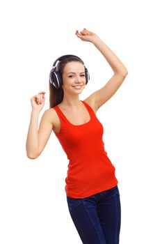 Happy smiling girl dancing and listening to music