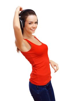 Happy smiling girl dancing and listening to music