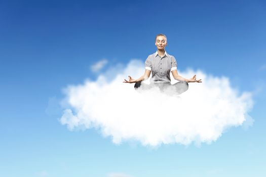 Businesswoman meditating sitting on the white cloud