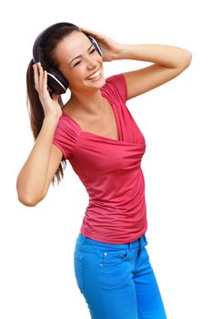 Happy smiling girl dancing and listening to music