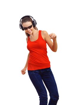 Happy smiling girl dancing and listening to music