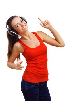 Happy smiling girl dancing and listening to music