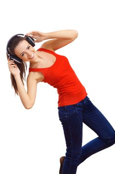 Happy smiling girl dancing and listening to music