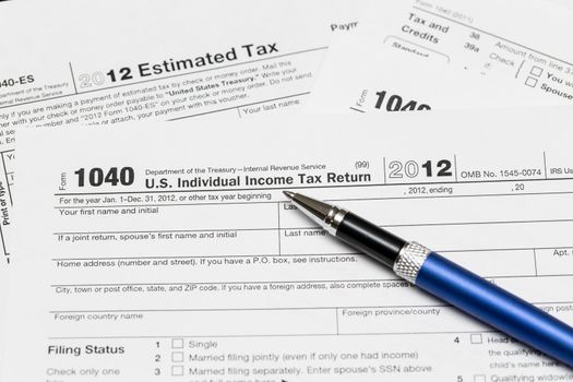 Tax form 1040 for tax year 2012 for US individual tax return with pen