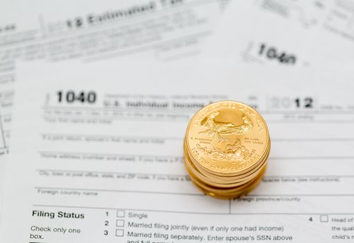 Tax form 1040 for tax year 2012 for US individual tax return with gold coins