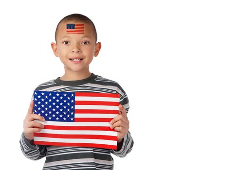 A proud american boy displays an american flag on his forehead and in his hands.