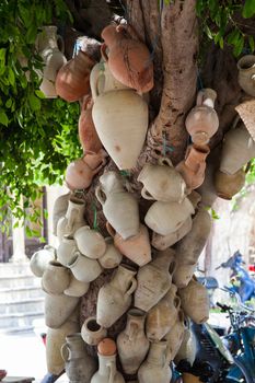 Hanging pots at market, a traditional pottery Djerba, Tunisia